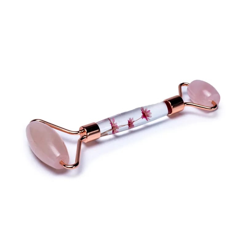 Massage roller in Rose Quartz and pink flowers in the handle