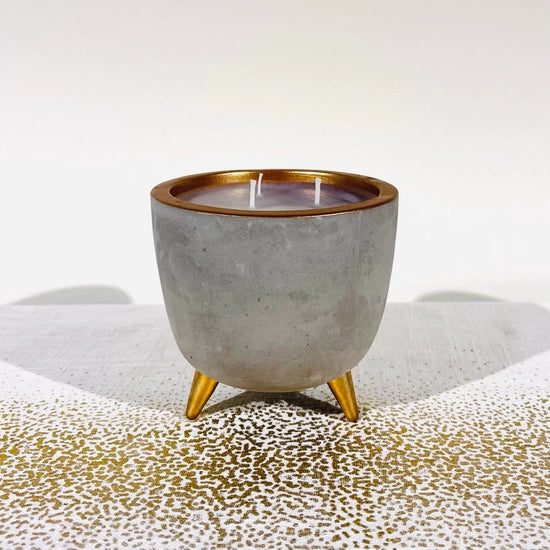 Candle in a copper and concrete pot